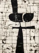 Zwarte abstracte kruisvorm op crème achtergrond