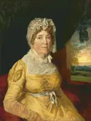 An Unknown Woman van James Ward: portret met vrouw, kanten muts, gele jurk en stoel, in warm geel en rood