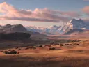 Schilderij van een kudde bizons in een bergvallei bij zonsondergang
