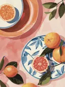 Sinaasappels en een grapefruit op blauw-wit gedecoreerde borden.
