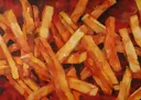 Abstract schilderij van gouden frietjes tegen een rode achtergrond