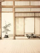 Japans interieur met bonsaiboompje, laag tafeltje en schuifdeuren.