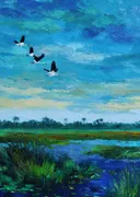 Drie kraanvogels vliegend boven een moerasgebied