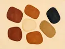 Losse kiezelstenen in de stijl Organic Geometry, in terracotta, roestoranje en romige crème, met een diepzwart accent