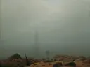 ‘‘Mist’‘ van Caspar David Friedrich: zee met mist, strand, zee en boot, in bleek grijsgroen