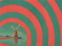 Schilderij van molen in koraalrood en zeegroen