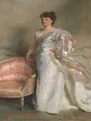 Mrs. George Swinton (Elizabeth Ebsworth) van John Singer Sargent: portret met vrouw, avondjurk, staand en roze fauteuil, in wit en zacht roze