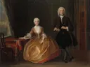 Musicerend paar van Cornelis Troost: interieur met paar, kamer, bladmuziek en tafel, in donker met goud en rood