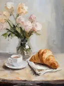 Croissant en koffie naast een boeket rozen