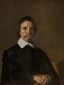 Portrait of a Man, possibly a Clergyman van Frans Hals: portret met man, zwarte mantel, kraag en baard, in donker bruin met wit