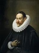 Portret van een heer van Juan Bautista Maíno: portret met man, molensteenkraag, zwarte mantel en baard, in zwart en wit