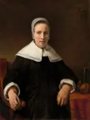 Portret van een vrouw met anjer van Atelier van Rembrandt: portret met vrouw, witte kraag, kapje en anjer, in zwart, wit en bruin