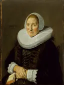 Portret van een vrouw van Frans Hals: portret met oude vrouw, kraag, kap en zittend, in donker met wit