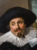 Portret van Isaac Massa (1586-1643) van Frans Hals: portret met man, hoed, kraag en glimlach, in donker met wit