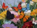 Schilderij van een cluster kleurrijke vlinders tegen een lichte achtergrond