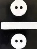 Grafisch symbool met witte cirkels op zwarte achtergrond