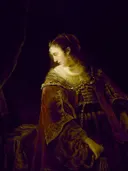 Woman at her Dressing Table van Ferdinand Bol: figuren met vrouw, kaptafel, gouden jurk en donker, in donker met goud