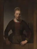 Young Woman at an Open Half Door van Rembrandt van Rijn: portret met jonge vrouw, deur, donkere kleding en handen, in donker bruin