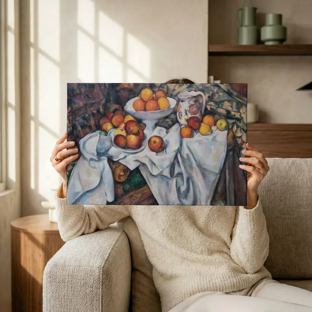 Sfeerimpressie: Appels en sinaasappels van Paul Cezanne terwijl het omhoog wordt gehouden