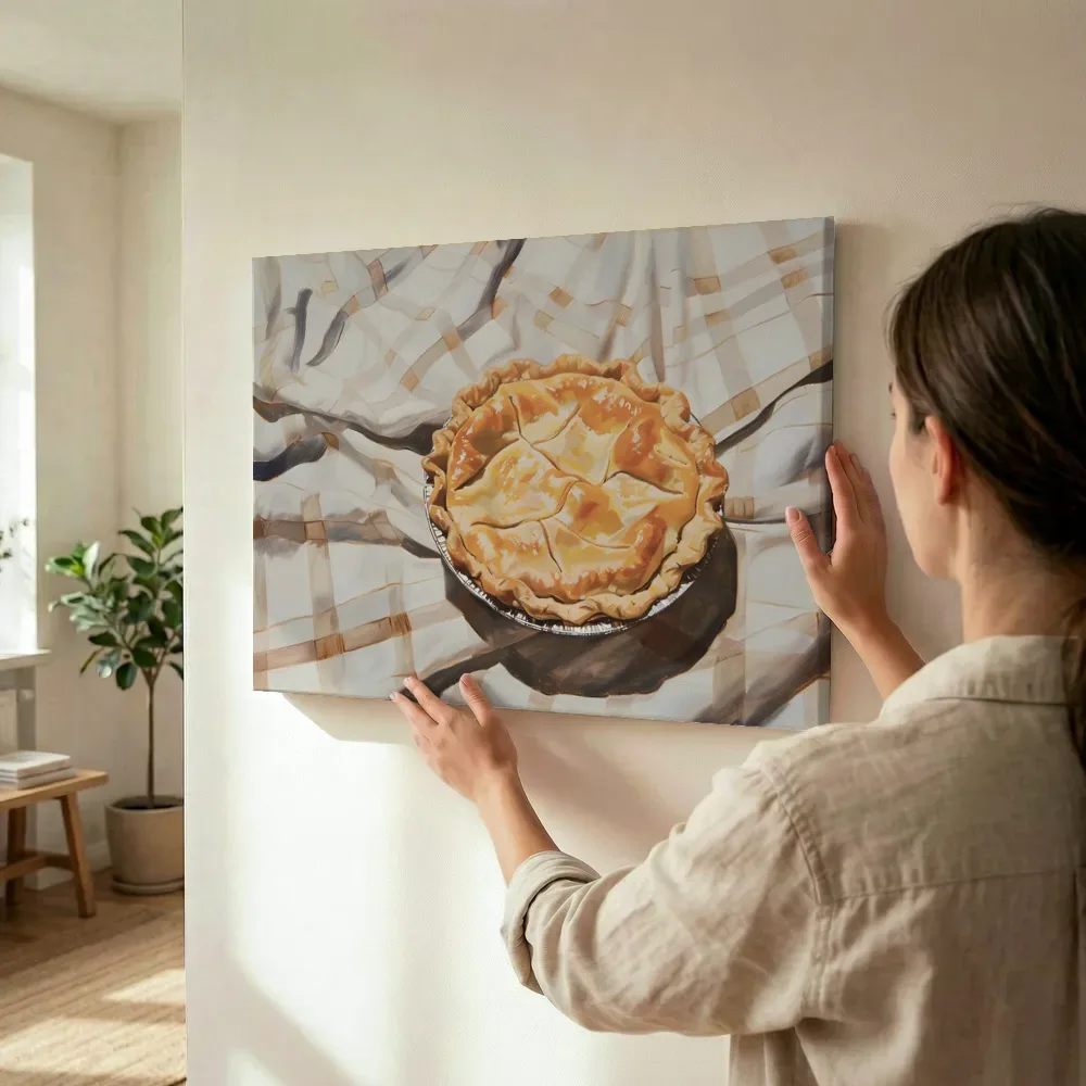 Sfeerimpressie: Appeltaart op geruit kleed terwijl het wordt opgehangen
