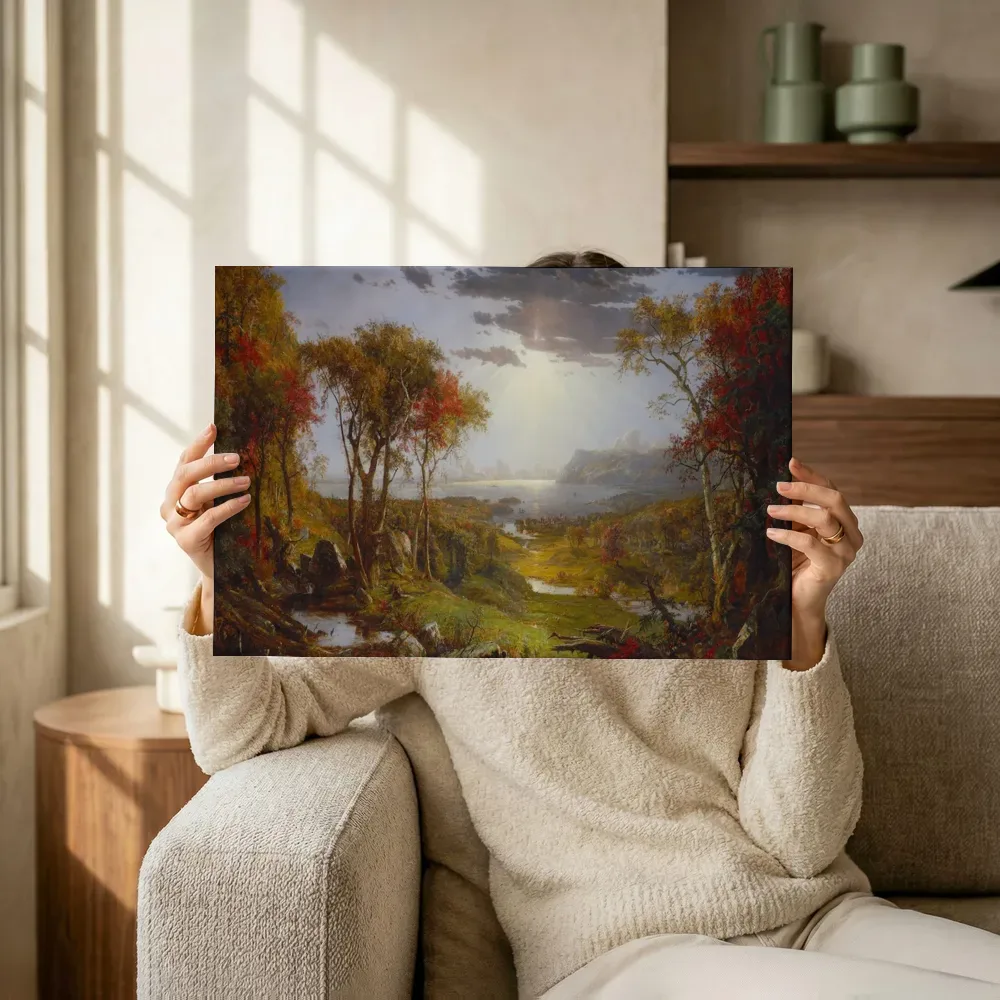 Sfeerimpressie: Herfst aan de Hudson van Jasper Francis Cropsey terwijl het omhoog wordt gehouden