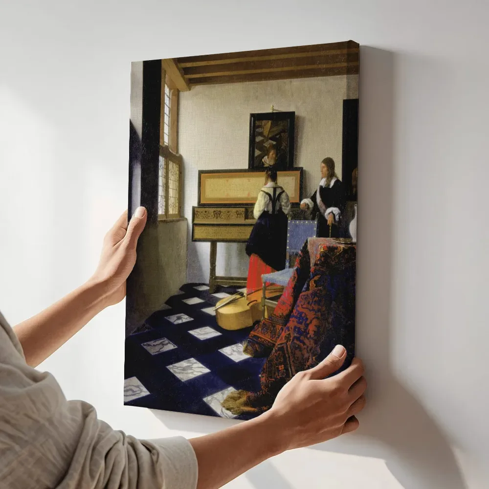 Sfeerimpressie: De muziekles van Johannes Vermeer terwijl het aan de muur wordt gehangen