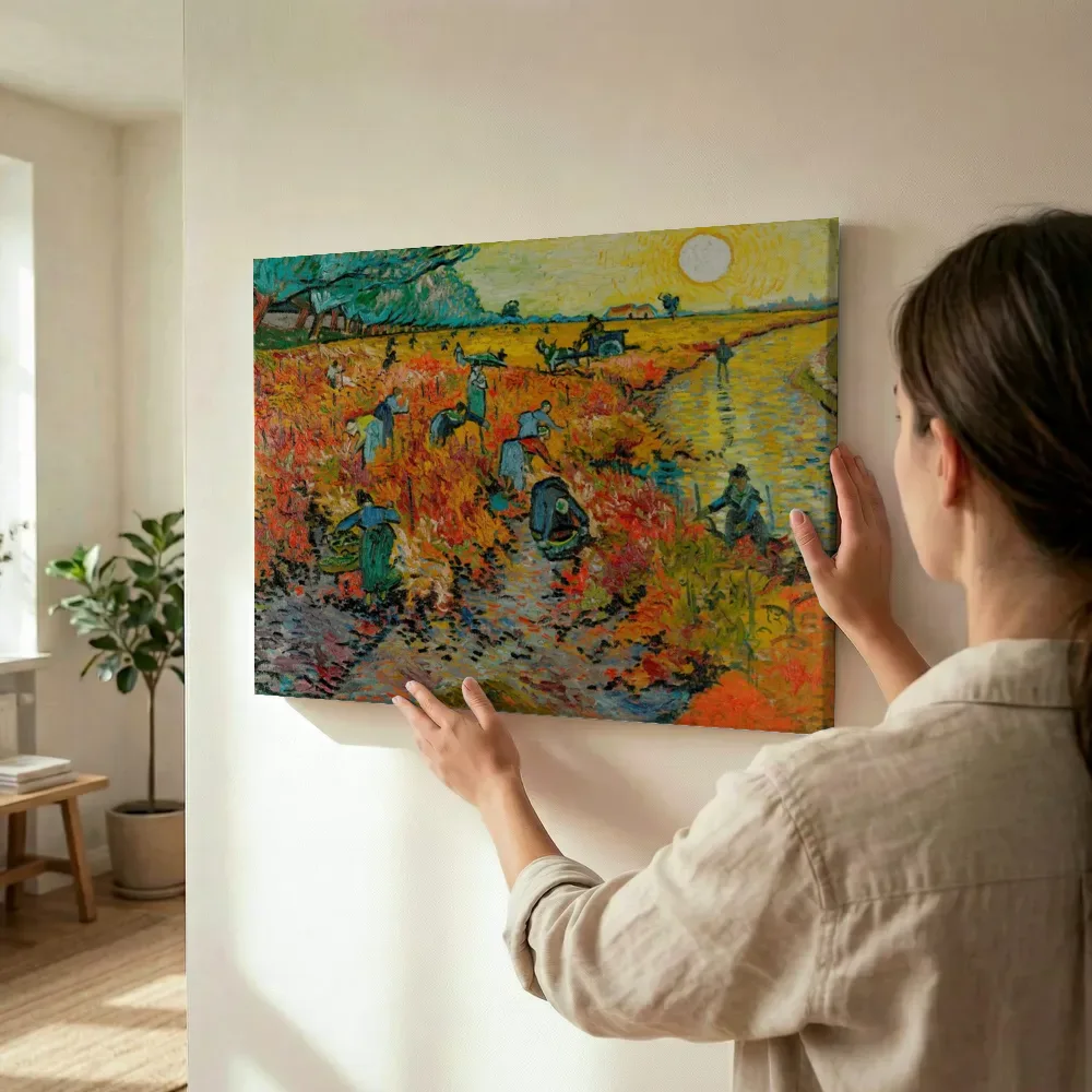 Sfeerimpressie: De rode wijngaard van Vincent van Gogh terwijl het wordt opgehangen