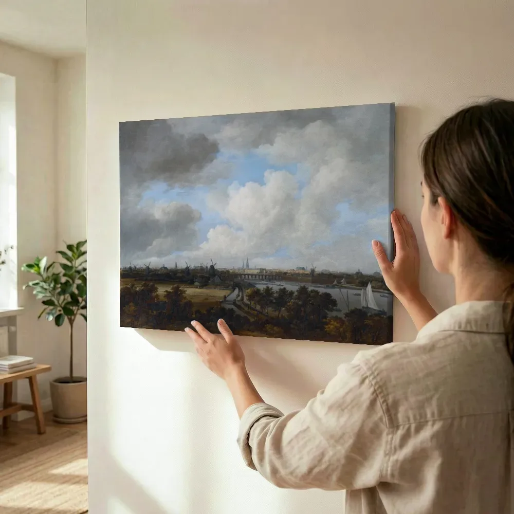 Sfeerimpressie: Gezicht op Amsterdam vanaf de Amsteldijk van Jacob van Ruisdael terwijl het wordt opgehangen
