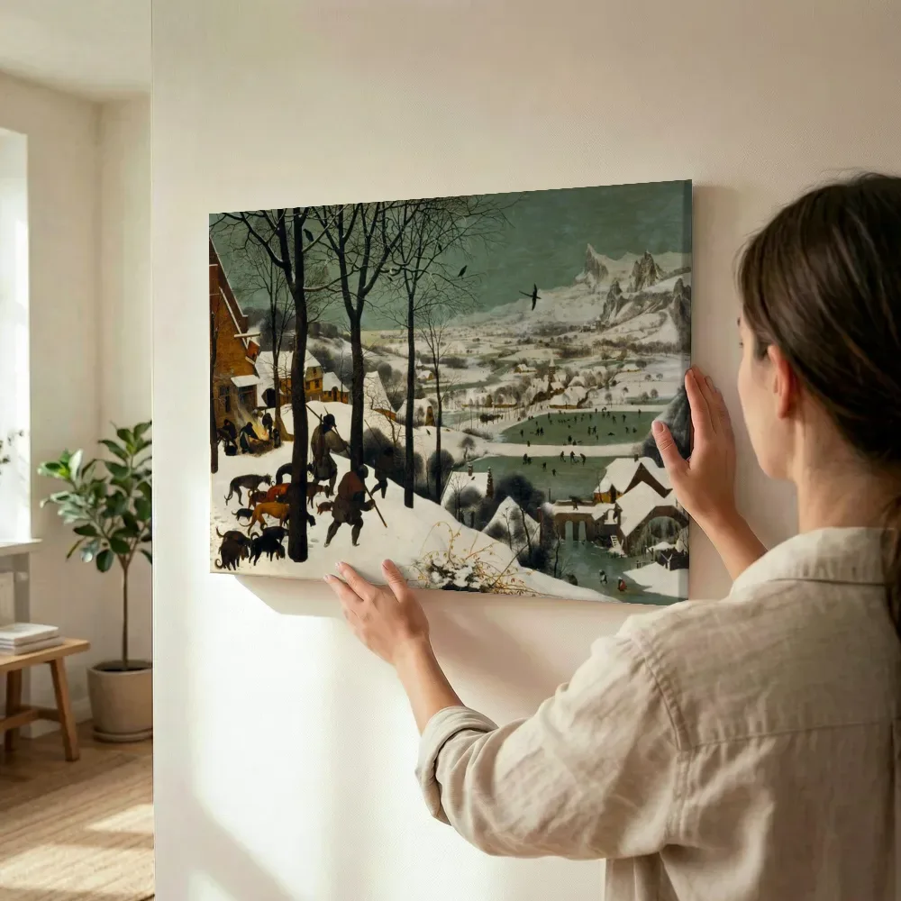 Sfeerimpressie: Jagers in de sneeuw van Pieter Bruegel de Oude terwijl het wordt opgehangen