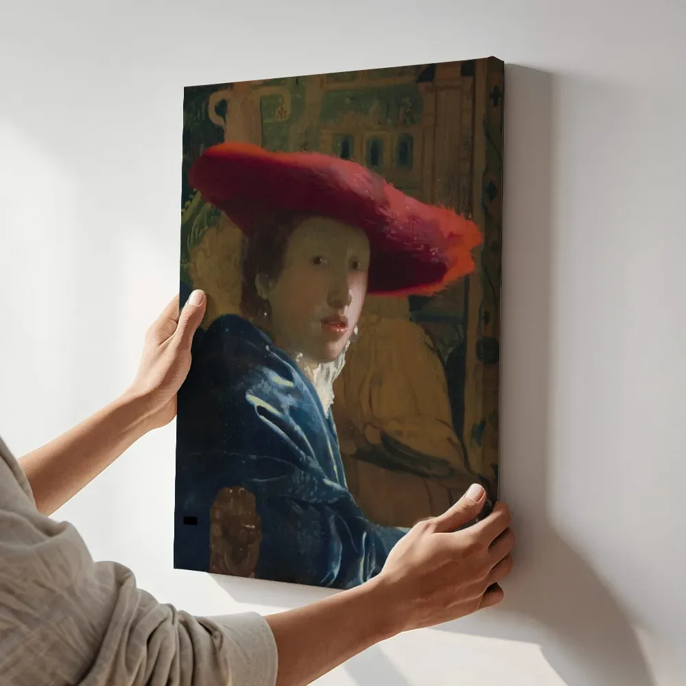 Sfeerimpressie: Meisje met de rode hoed van Johannes Vermeer terwijl het aan de muur wordt gehangen