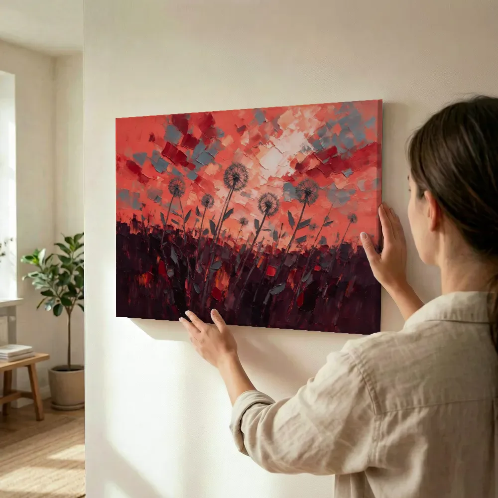 Sfeerimpressie: Paardenbloemen tegen een koraalrode lucht terwijl het omhoog wordt gehouden
