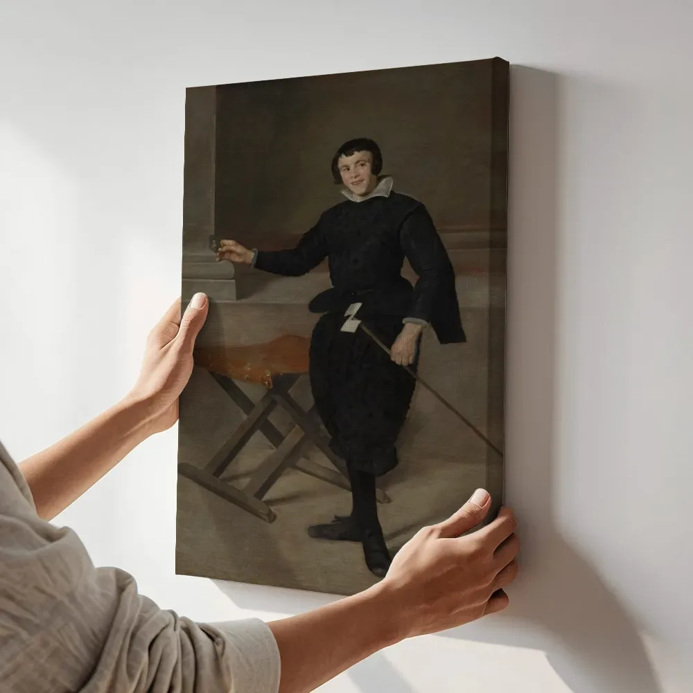 Sfeerimpressie: Portret van de nar Calabazas van Diego Velazquez terwijl het aan de muur wordt gehangen