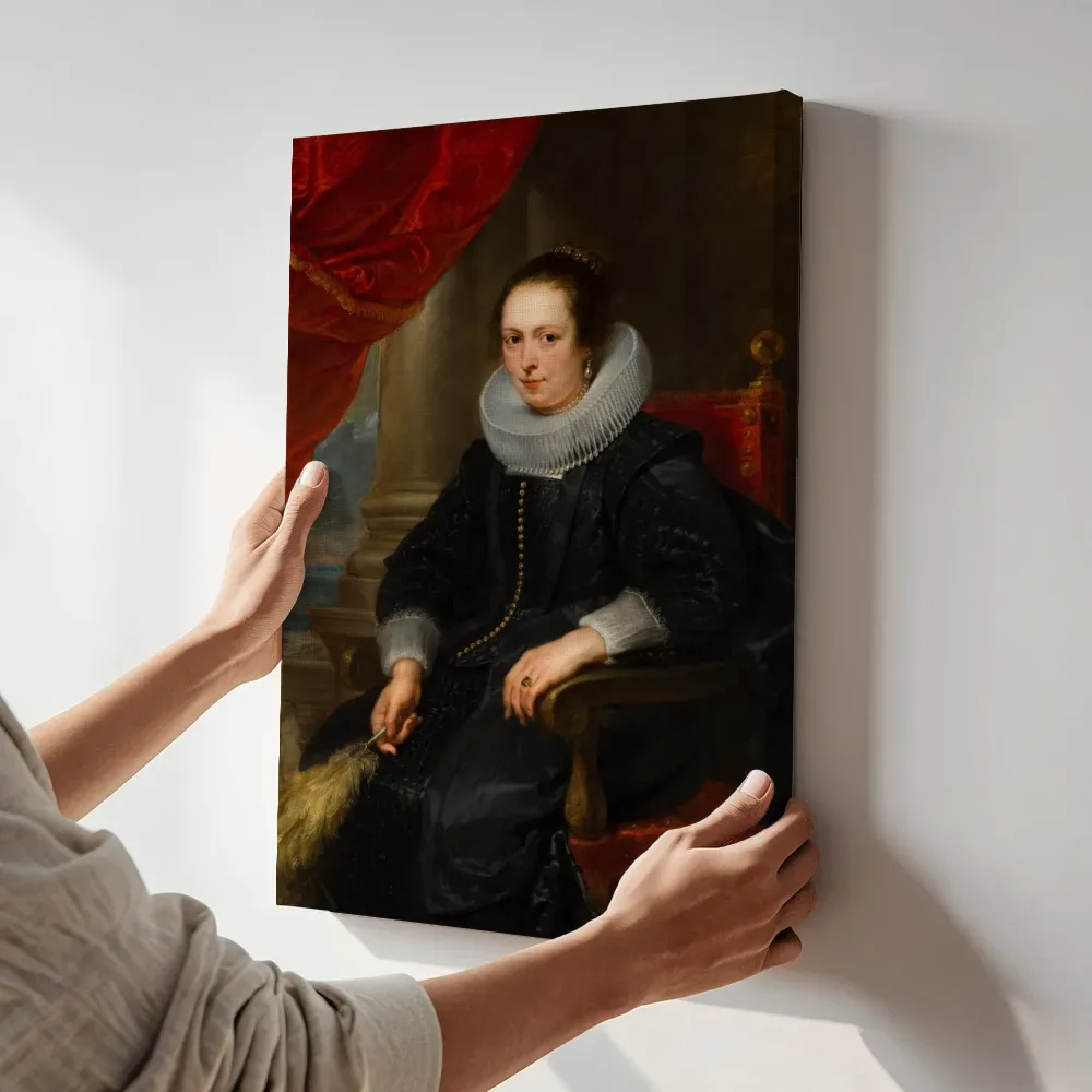 Sfeerimpressie: Portret van een vrouw, mogelijk Clara Fourment (1593-1643) van Anthony van Dyck, Peter Paul Rubens terwijl het aan de muur wordt gehangen