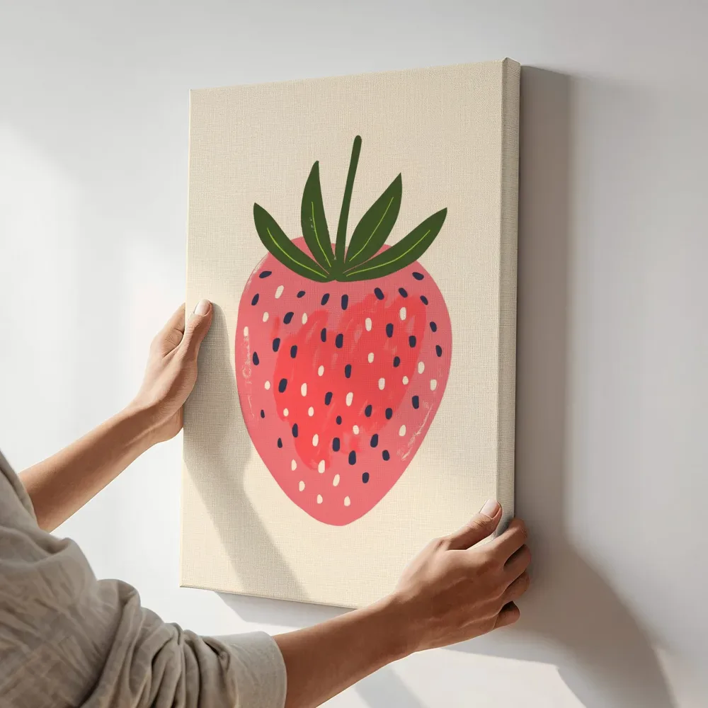 Sfeerimpressie: Vrolijke aardbei terwijl het aan de muur wordt gehangen