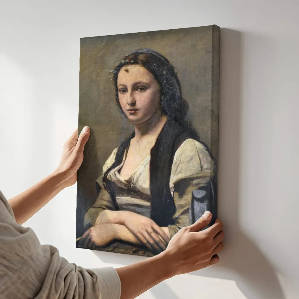 Sfeerimpressie: Vrouw met parel van Jean-Baptiste Camille Corot terwijl het aan de muur wordt gehangen