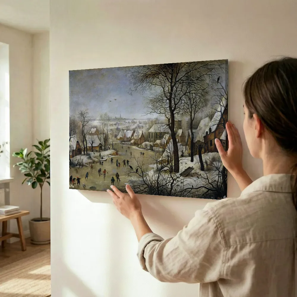 Sfeerimpressie: Wintergezicht met vogelknip van Pieter Brueghel de Jonge terwijl het wordt opgehangen