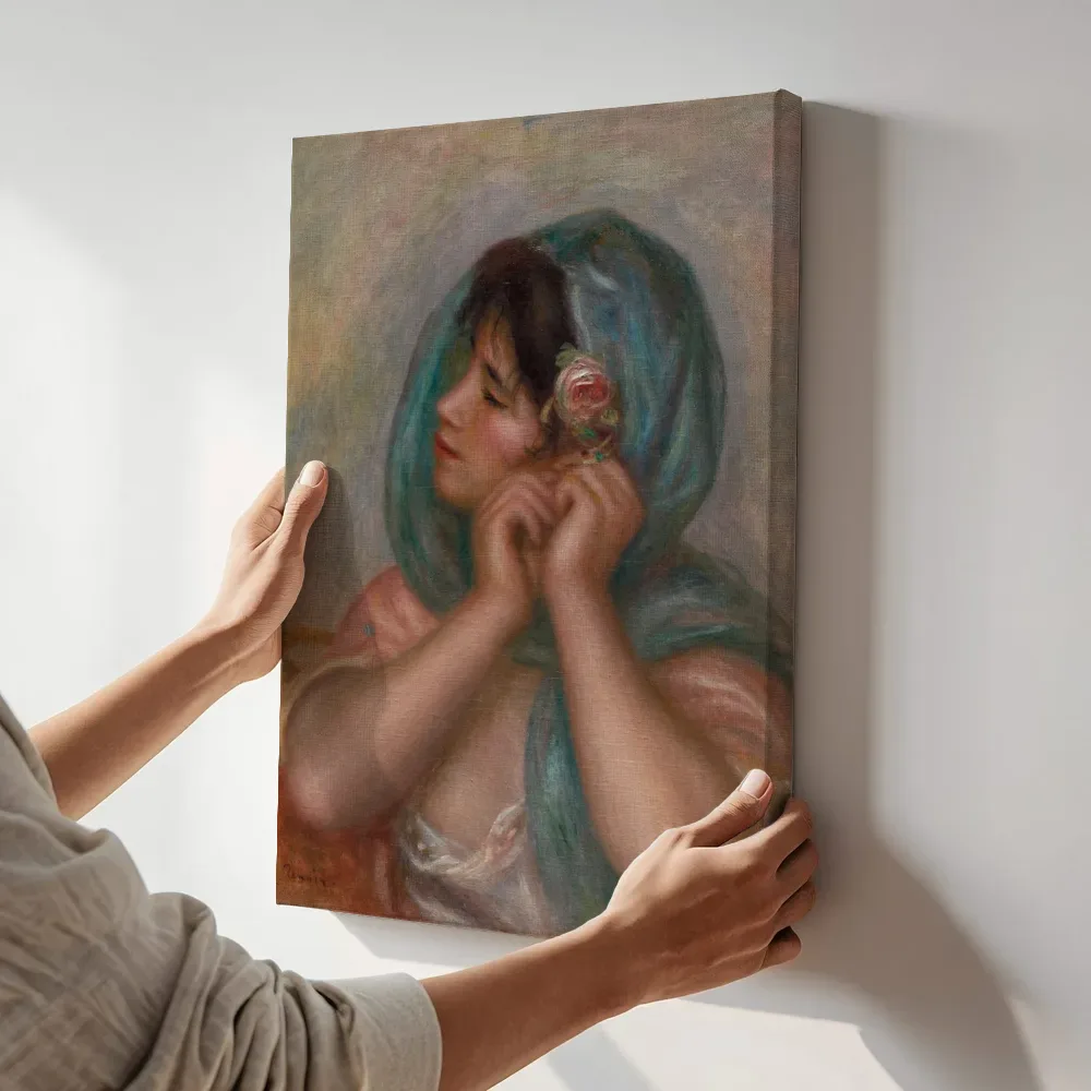 Sfeerimpressie: Jonge vrouw die haar oorbel omdoet van Pierre-Auguste Renoir terwijl het aan de muur wordt gehangen
